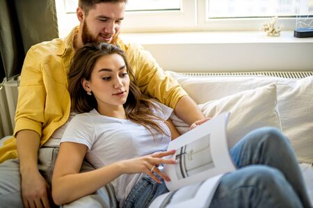 married caucasian couple relax and enjoy together at homeの写真素材