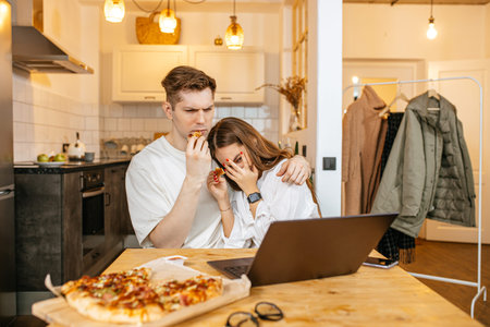 young caucasian couple spend quarantine at home together, married couple watch dangerous horror film...