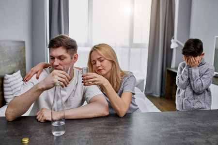alcoholics parents do not care for the child, caucasian family suffer from alcohol addiction....