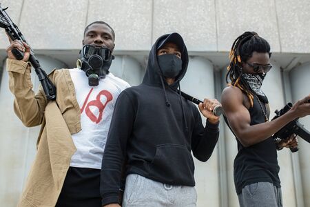 armed angry black activists go on anti-racism protest, they are ready to fight with police and with injustice in USA. blacks, afroamericans, dark-skinned peopleの写真素材