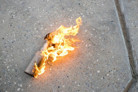 close-up photo of burning glass bottle with cloth in the streets. blm, black lives matter, protest, revolution, rebellion conceptの写真素材
