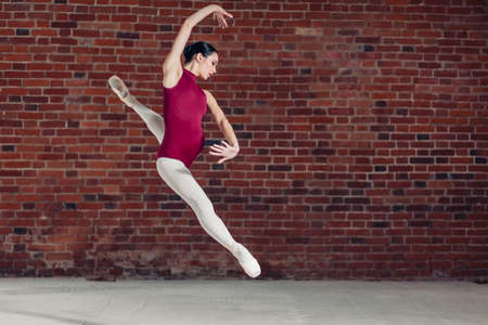 motivated active choreographer doing a stunt, full length photo. copy spaceの写真素材