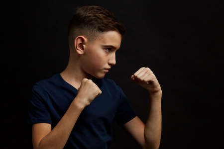 profile of Young boy boxer pose of protection. Look asideの写真素材