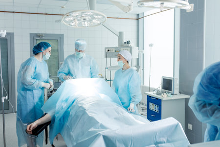 Team of surgeons working with patient in the light operating room. cosmetic surgery.job, profession