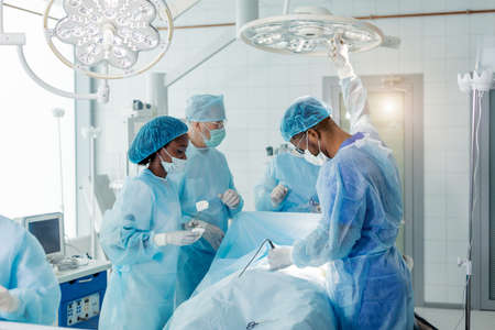dmotivated skilled multiracial doctors working with donor. heart, lungs, breast surgeryの写真素材