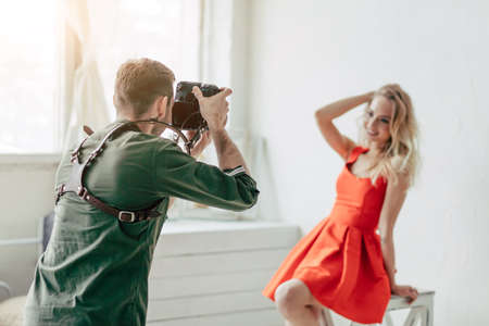 blonde young fashion girl taking part in the photo session, close up photoの写真素材