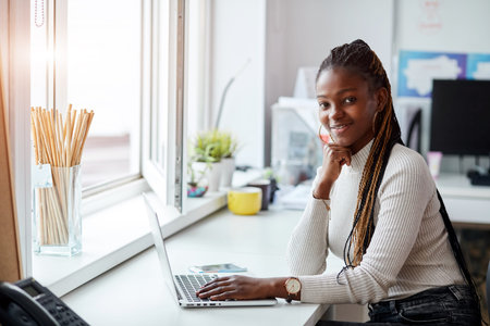 gorgeous beautiful manager using her laptop at workplace. career, management, business concept. copy...