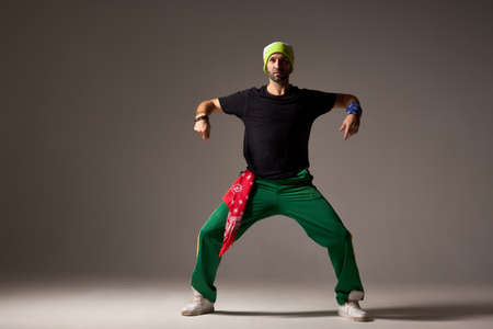 Attractive professional dancer performing modern hip hop style danceの写真素材