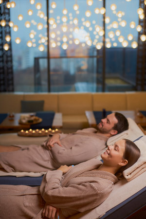 weekends of young, cute happy couple taking rest together in spa salon, enjoy time in beauty salon,...