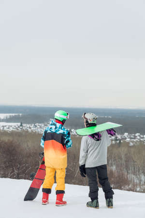 two active sportsmen exploring the mountain for snowboarding, full length photo.hovvy, sporty life, lifestyleの写真素材