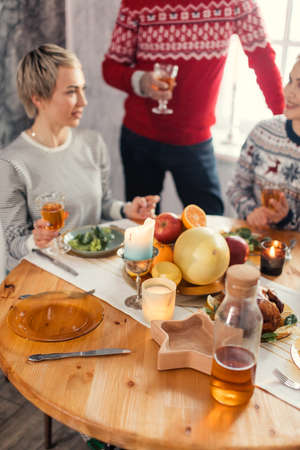 close up cropped photo. focus on empty plate with a knife and a fork. blurred backgroundの写真素材
