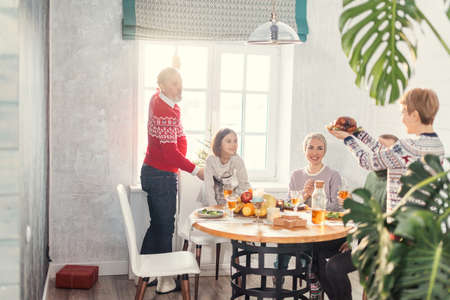 excited family is going to taste yummy roasted turkey. prepared turkey for relatives, tasty traditionの写真素材