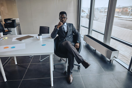 fashion office worker is resting in the office chair in the modern office. break, job, profesion