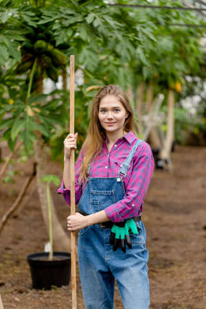 gardeners working day. close up portrait.girl likes working in the gardenの写真素材