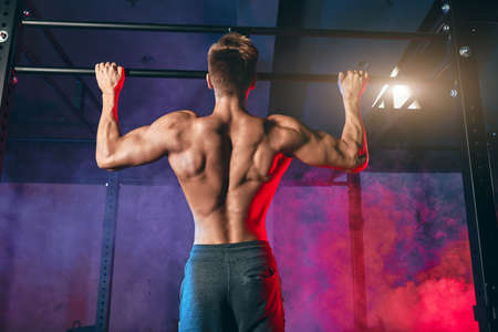 Two-time Games competitor and owner of Cross Fit Park City, teaches athletes to be efficient in various pull-up techniques.の素材 [FY310153422349]