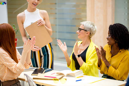 businesswoman has finished her successful presentation. close up cropped photo.の写真素材