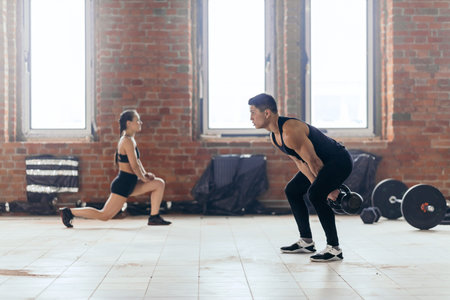 young motivated couple working out at gym. lifestyle, hobby, interest, free time