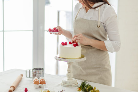 work of art. creation of intricate and beguiling designs decorating a cake, close up cropped photo