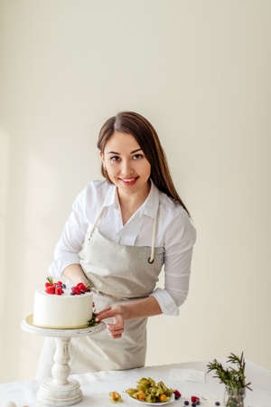 smiling girl offers fresh delicious dessert, close up photo, service conceptの写真素材