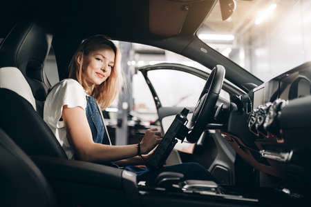 attractive staff helping you to repair your car. close up photoの写真素材
