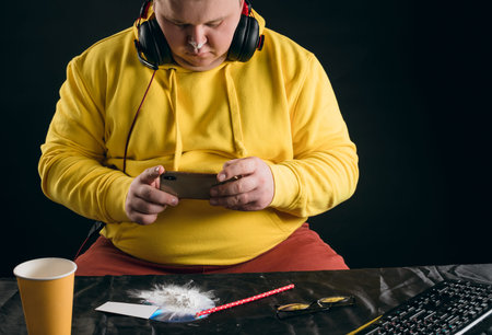 young plump man taking pictures of drugs, guy is chatting with dillers. close up portrait, isolated...