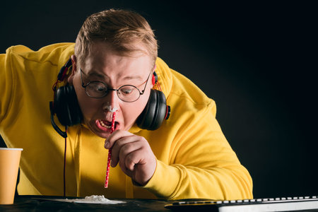 excited man sniffing cocaine at home. close up photo. development a cocaine addiction. copy space