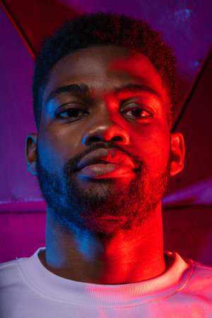 brutal guy with unshaven face, low view photo, dark skinned man with full lips
