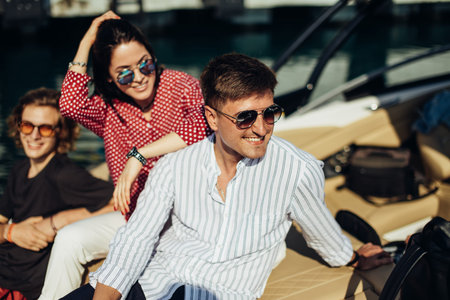Cheerful students on vacation having fun by the ocean - Concept of joyful moments with attractive...