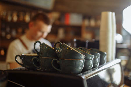 blue coffee cups on the shelf at the cafe . blurred backgroundの写真素材