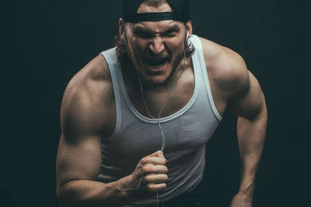 powerful angry man is eager to win. willpower concept.. strength of willの写真素材