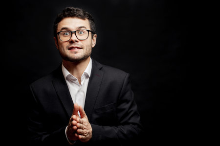 elegant man rubbs his hands. businessman is waiting for the results of the lottery