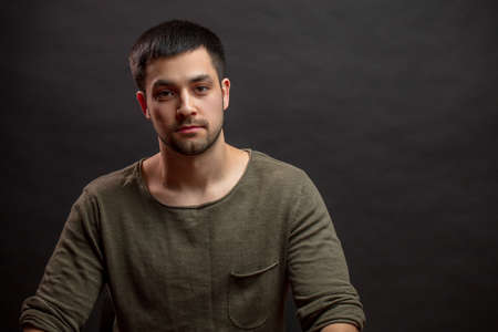 handsome man with brown hair and beautiful brown eyes. copyspaceの写真素材