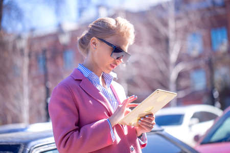 close up side view photo of nice woman using her laptop to find place. find bearingsの写真素材