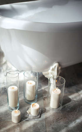 candles for romantic date in the bathroom with modern interiorの写真素材