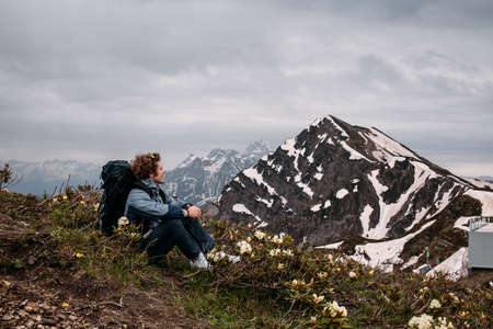 positive guy loves his motherland. house, landscape, idyll concept. side view photoの写真素材