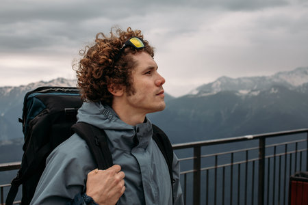 young attractive man travels around the world. experienced tourist. close up side view shot.