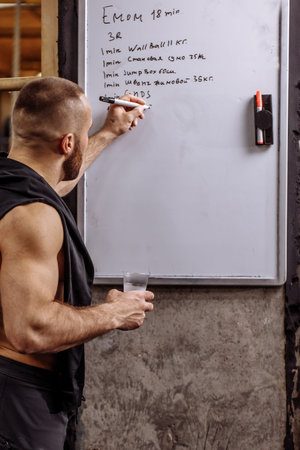 program and plan for sportsman. athlete writing down goals