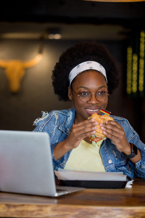 Happy African tourist female visiting new country on her summer vacation. Young Traveller having...