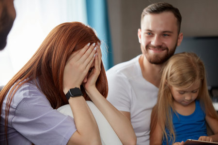 redhead woman suffering from postpartum depression, she came with daughter and husband to get...