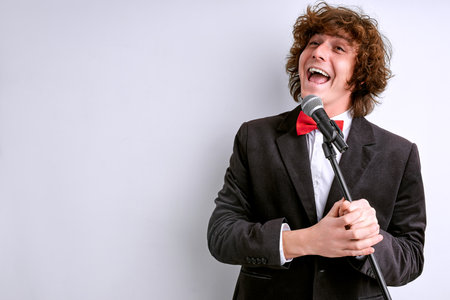 singer singing expressive in vocal microphone, vocalist of classic music. isolated white backgroundの写真素材