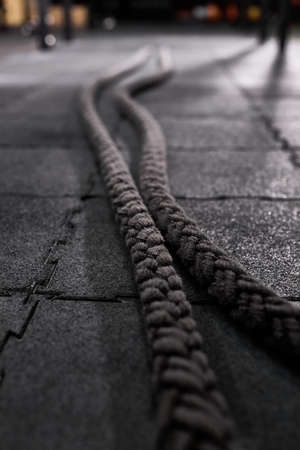 close-up battle ropes for cross fit on the floor in gym, focus on ropes. sport equipment conceptの写真素材