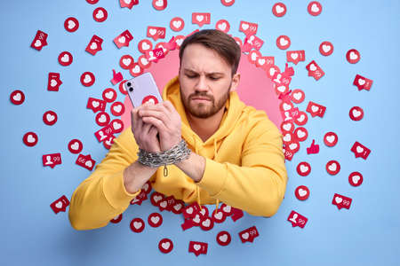 Young Man Using Smart Phone background.の写真素材