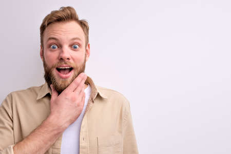 Surprised Male Touching Chin Thinking, Stand In Contemplationの写真素材