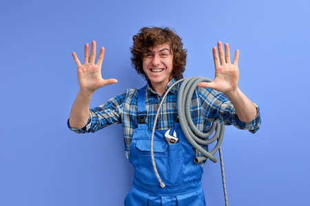 handsome optimistic plumber man welcoming clientsの写真素材