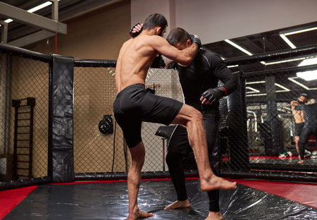 MMA. Two professional boxers boxing, athletes fighting. Sport, competition, excitement and human...