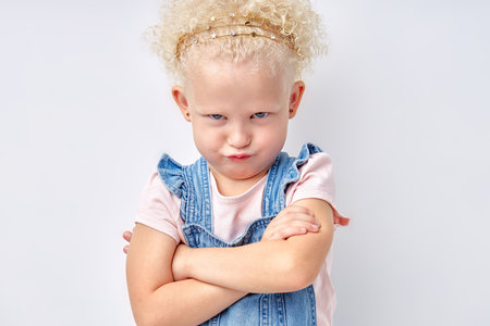 Naughty caucasian child. Disobedience problem. Discipline punishment. Portrait of angry offended...
