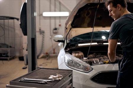 man checking hood of car, engine before a trip or journey, Car check condition concept. rear view,...