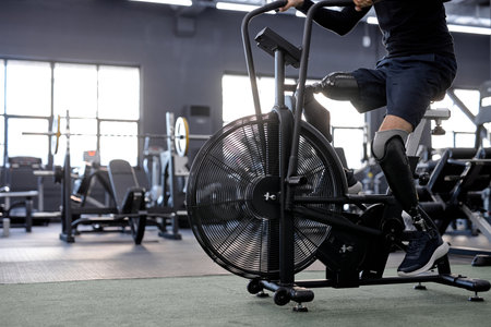 artificial legs pedaling at gym, close up cropped side view shotの写真素材