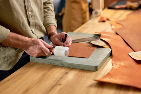 man's arms working with Mauls and Pricking Irons, close up side view cropped photoの写真素材