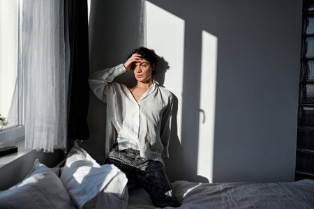 Man touching forehead having headache, guy tries to remember what did he yesterday, bad memory, full length photo.の写真素材